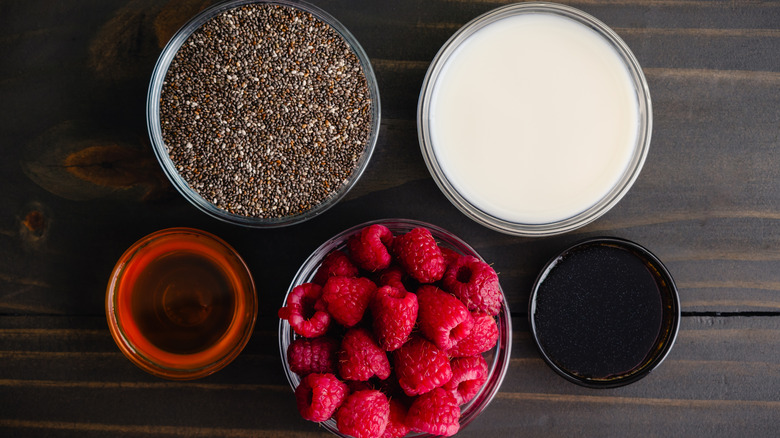 Individual chia seed pudding ingredients in separate small bowls