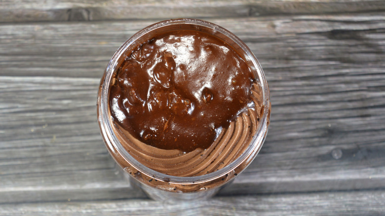 Mousse topped with chocolate sauce