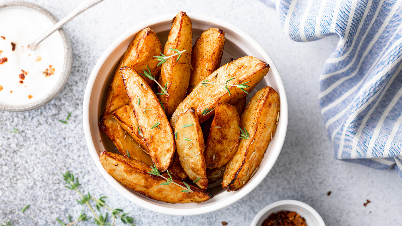 https://www.tastingtable.com/img/gallery/make-easy-potato-wedges-with-a-kitchen-tool-you-might-already-own/l-intro-1680806467.jpg