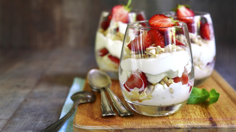 Classic Eton mess on a wooden chopping board