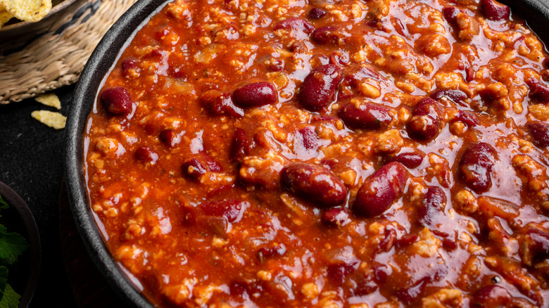 Close up of chili with beans in a black pot
