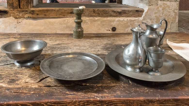 Pewter tableware on wood table