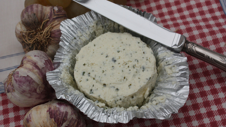 An open package of Boursin cheese.