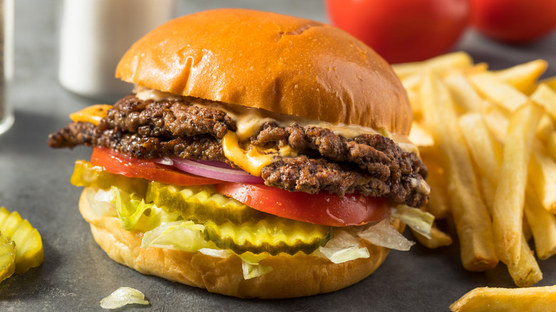 A smash burger with fries