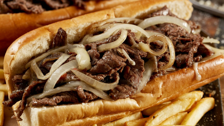 Cheesesteak sandwich with fries on the side