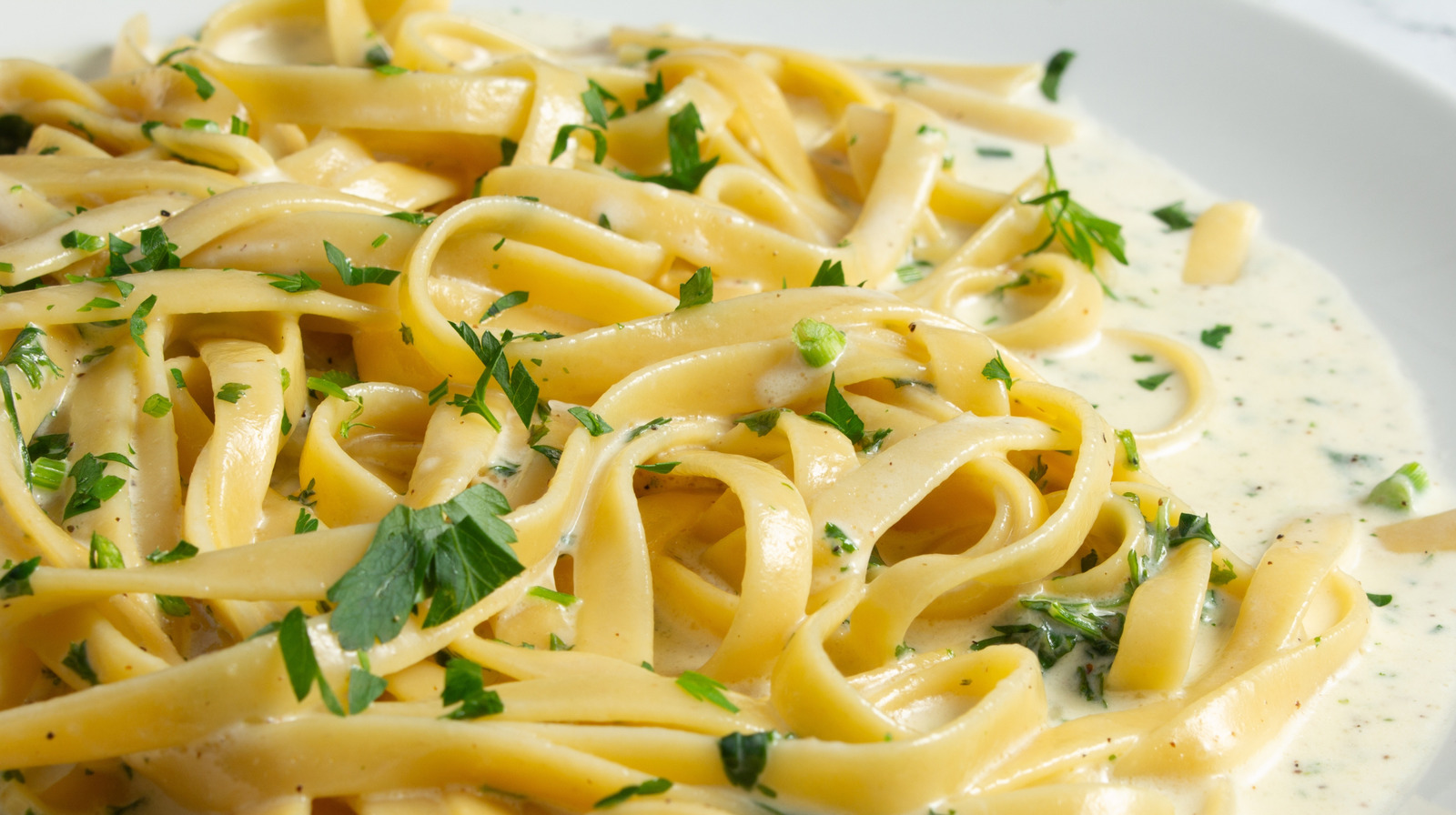 Make The Most Decadent Alfredo Sauce With This Canned Ingredient Shortcut - Tasting Table