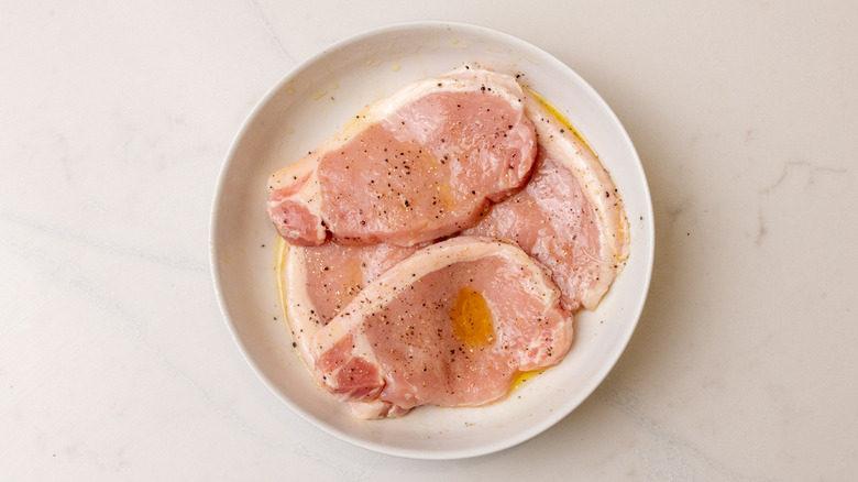 seasoned pork chops in bowl