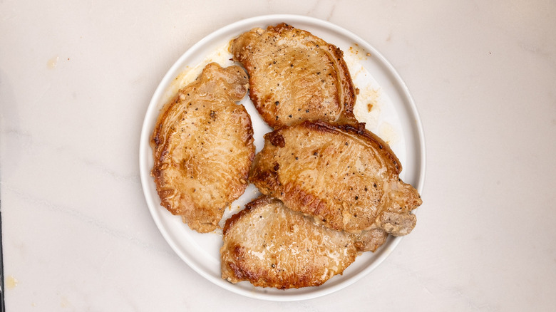 cooked pork chops on plate