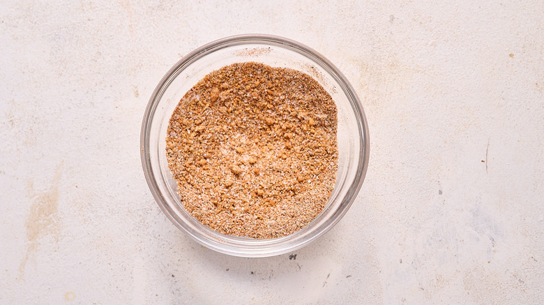 aerial view of mixing spices in a glass bowl