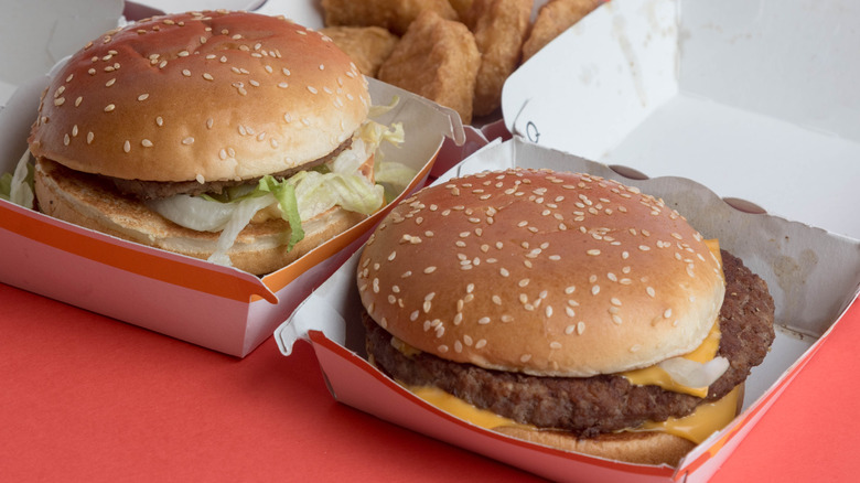 A McDonald's Big Mac in a box next to a McDonald's Quarter Pounder in a box