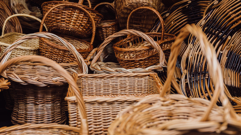 A collection of large wicker baskets with handles