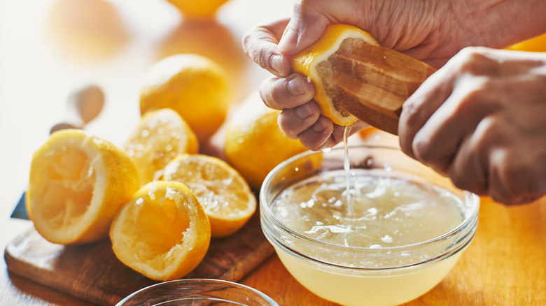 woman juicing a lemon