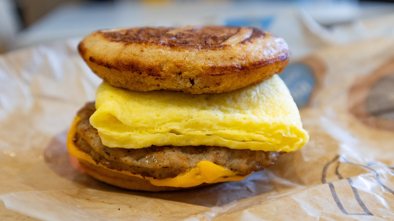 A McDonald's sausage McGriddle featuring a folded egg on top of the sausage patty