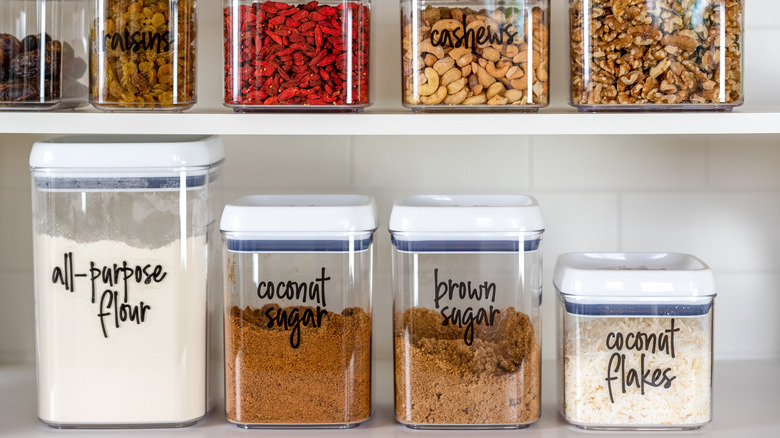 Containers of sugar and flour in pantry
