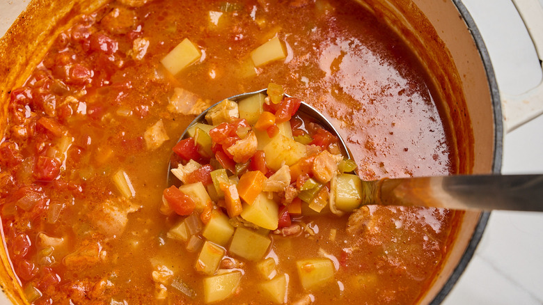 ladling clam chowder out of pot