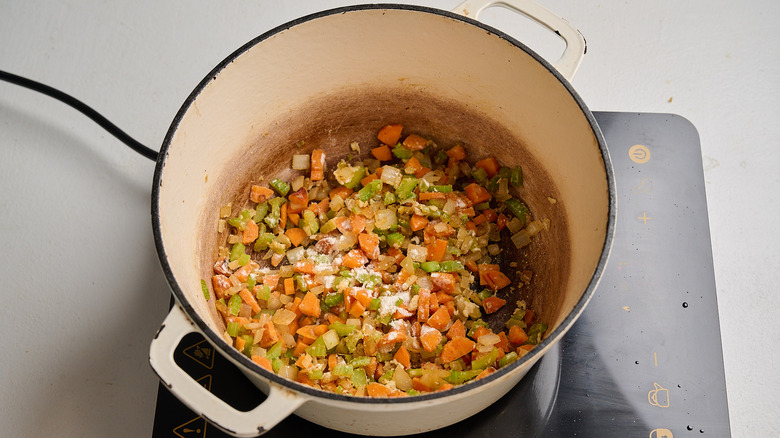 flour mixed into the vegetables in pot