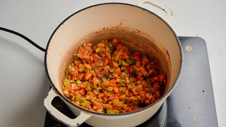 tomato paste stirred into vegetables