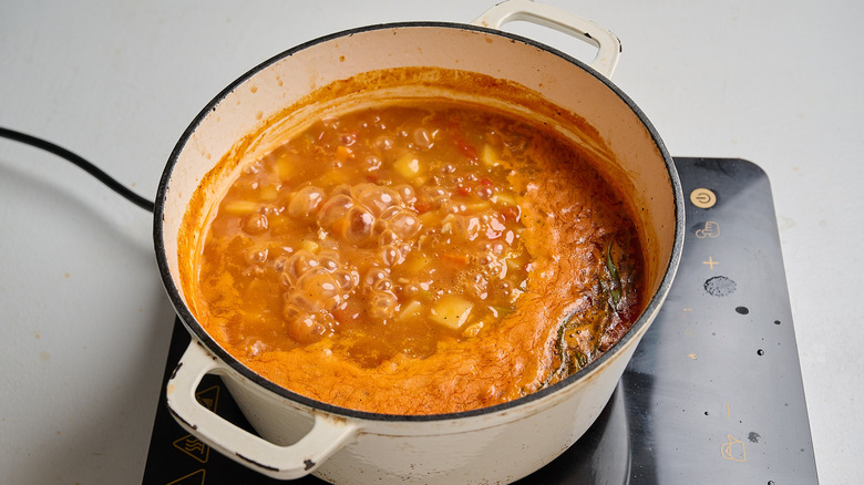 boiling soup to cook potatoes