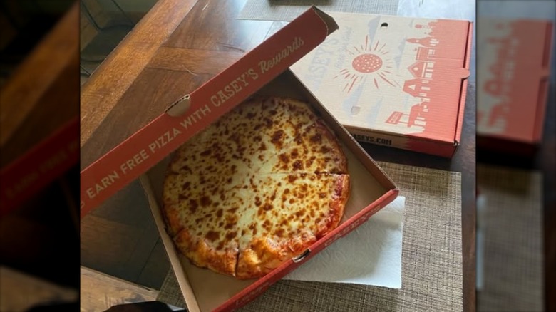 A red box filled with Casey's General Store pizza