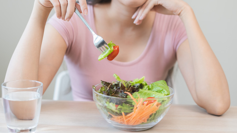person with boring salad