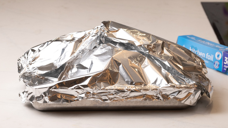 chicken covered in foil