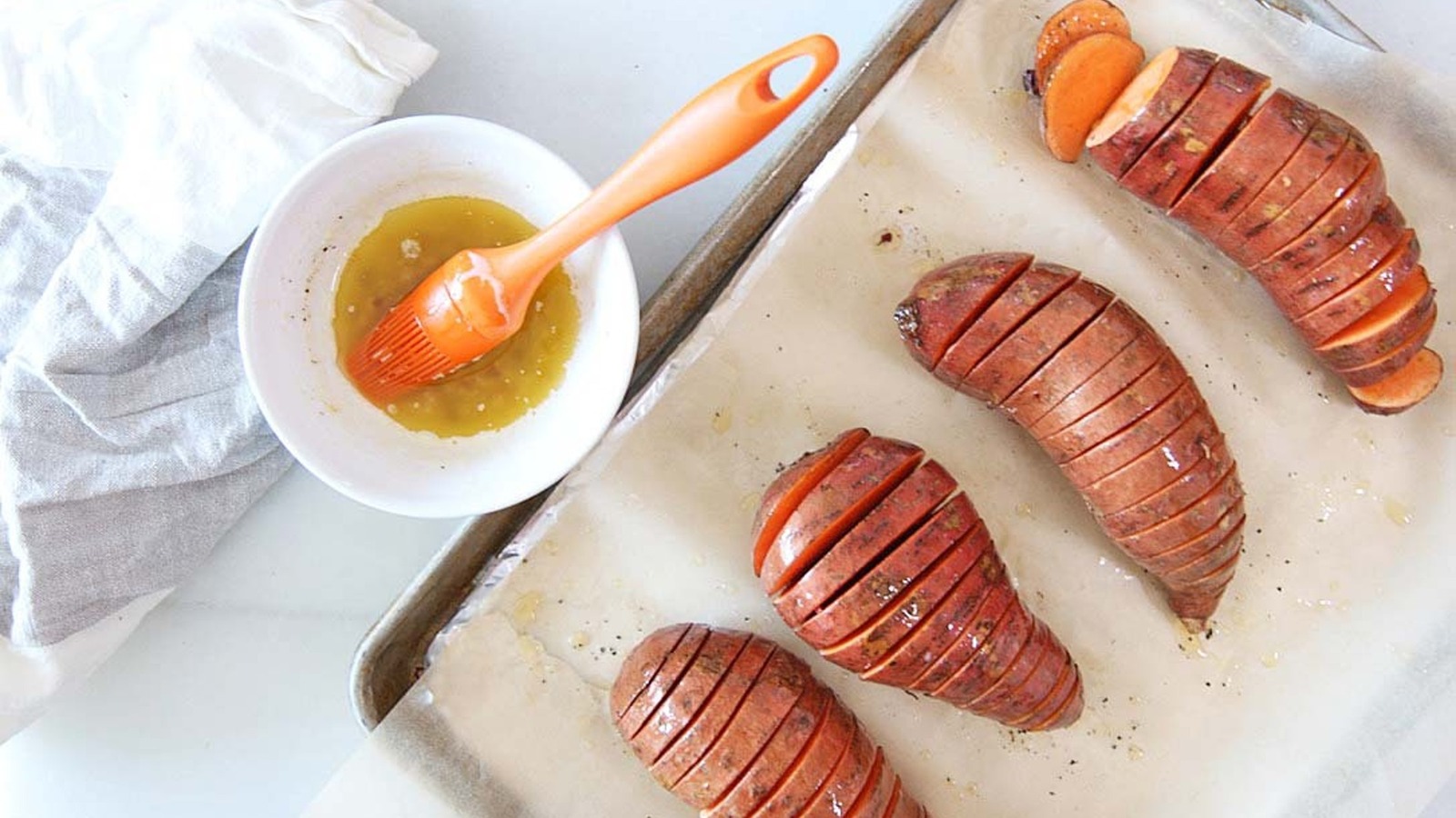 Maple Syrup Is The Key To Elevating Hasselback Sweet Potatoes