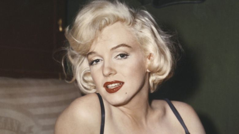Marilyn Monroe in red lipstick and strapless shirt