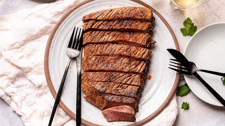london broil with utensils