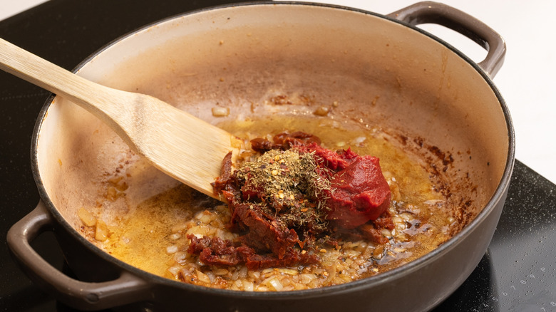 tomato and seasonings in pan