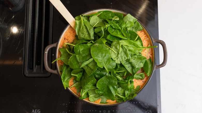 wilting spinach into soup