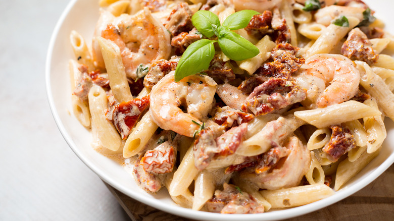 Marry me shrimp pasta in white bowl