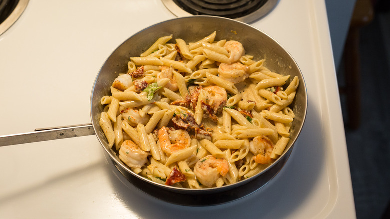creamy shrimp pasta in frying pan