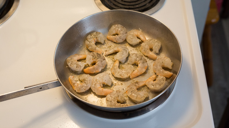 shrimp cooking in frying pan