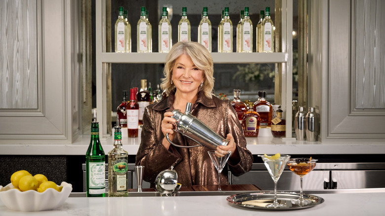 Martha Stewart smiling and mixing a cocktail in The Bedford Foxwoods bar