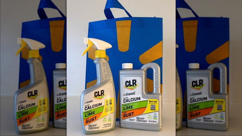 Bottles of Calcium, Lime, & Rust Remover on a kitchen counter in front of a blue Walmart bag