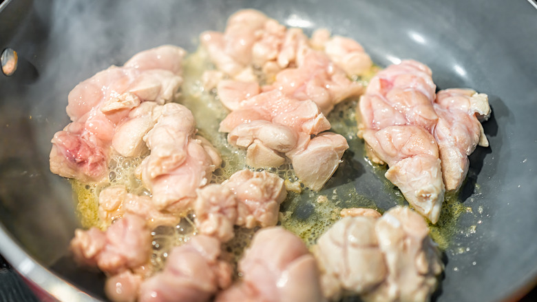 Sweetbreads frying in a pan