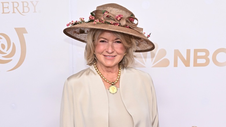 Martha Stewart wearing a Kentucky Derby hat and smiling