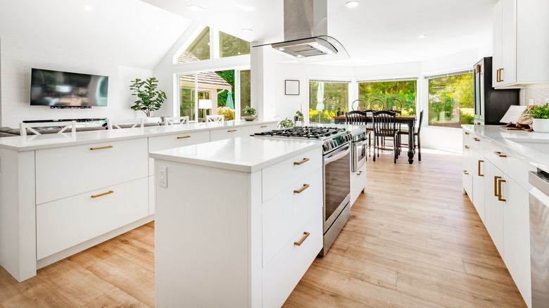 Modern white kitchen with a second island for seating and storage