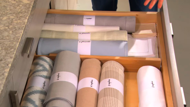 close up of Martha Stewart's drawer of rolled cloth napkins
