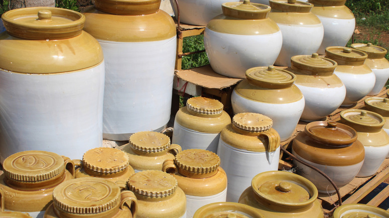 Row of traditional pickle crocks