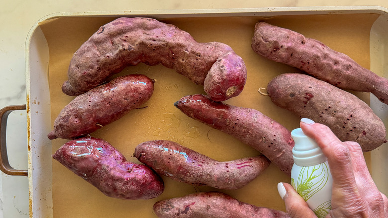 hand spraying potatoes