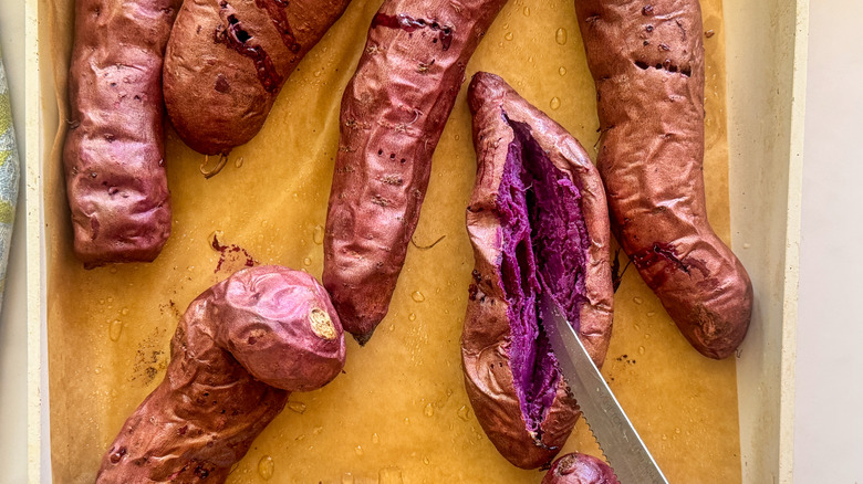 knife slicing open potato