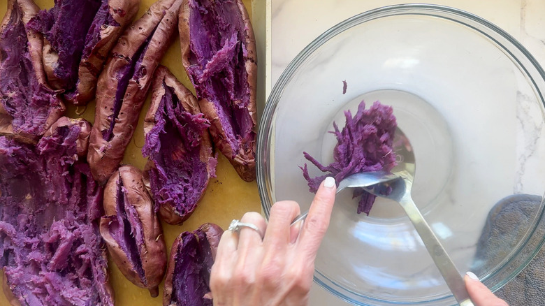 hand putting potatoes in bowl