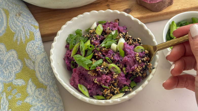 fork in mashed sweet potatoes