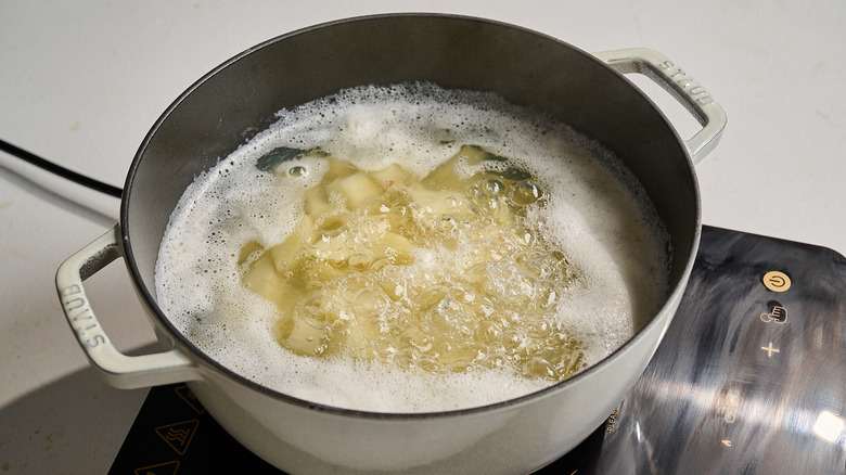 boiling potatoes in a large pot