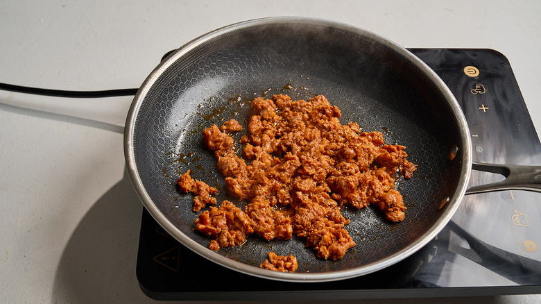 cooking chorizo in a skillet
