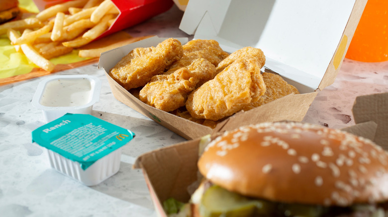McDonald's chicken nuggets, burger, and fries on table
