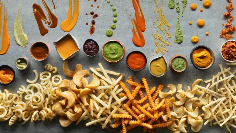 a variety of fry cuts side-by-side with colorful sauces