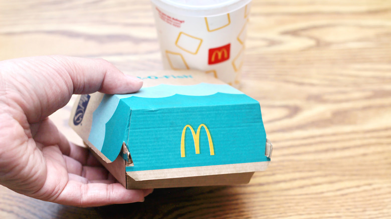 customer holding Filet-O-Fish box
