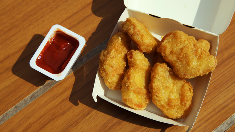 Overhead view of McDonald's chicken McNuggets with dipping sauce